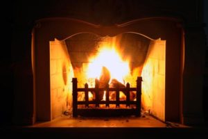 beautiful fireplace burning wood.