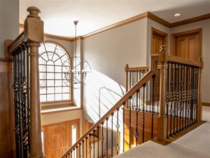 Stairwell Spindles and Large Orb Chandelier