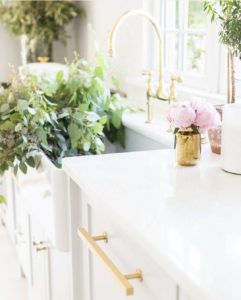 White Kitchen with Gold Hardware and Living Flowers
