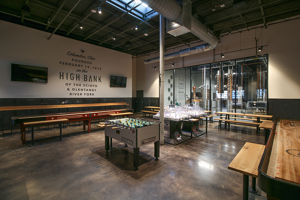 large game room with high ceilings and High Bank logo on wall