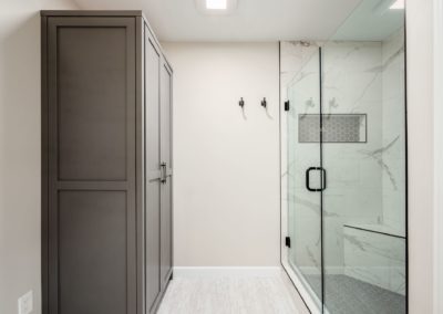 Grey cabinet, shower with glass door