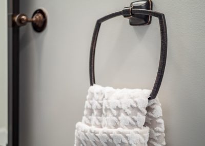 houndsooth white and grey towel on a dark towel rack