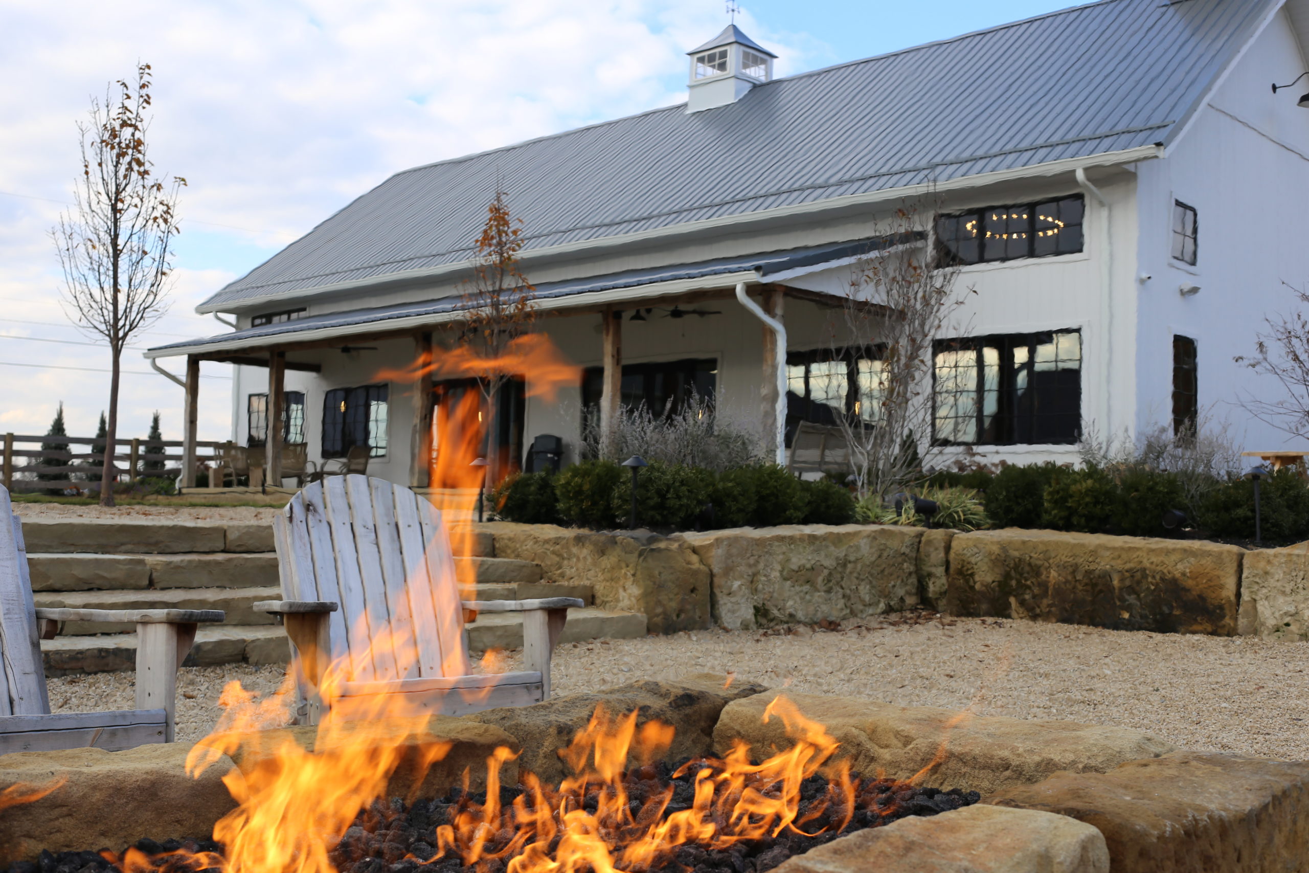 fire pit with brewery in the background