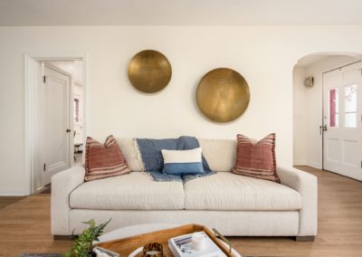 couch with neutral, blush and blue tone
