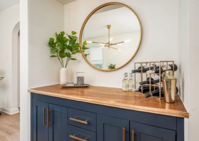 blue bar with brass mirror and accessories