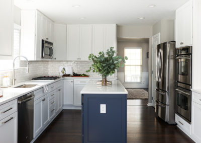 White Cabinetry Kitchen Remodel with Blue Island