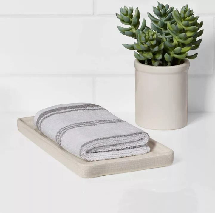 Crackled finish vanity tray with greenery for bathroom decor