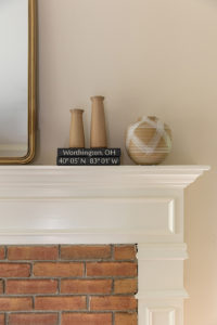 White Fireplace with red brick and modern decor