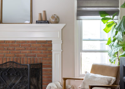 White Fireplace with red brick and modern decor