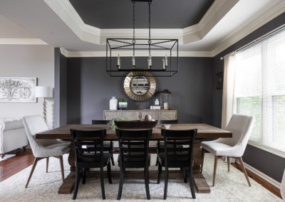 Modern traditional dining room with chandelier, and sideboard